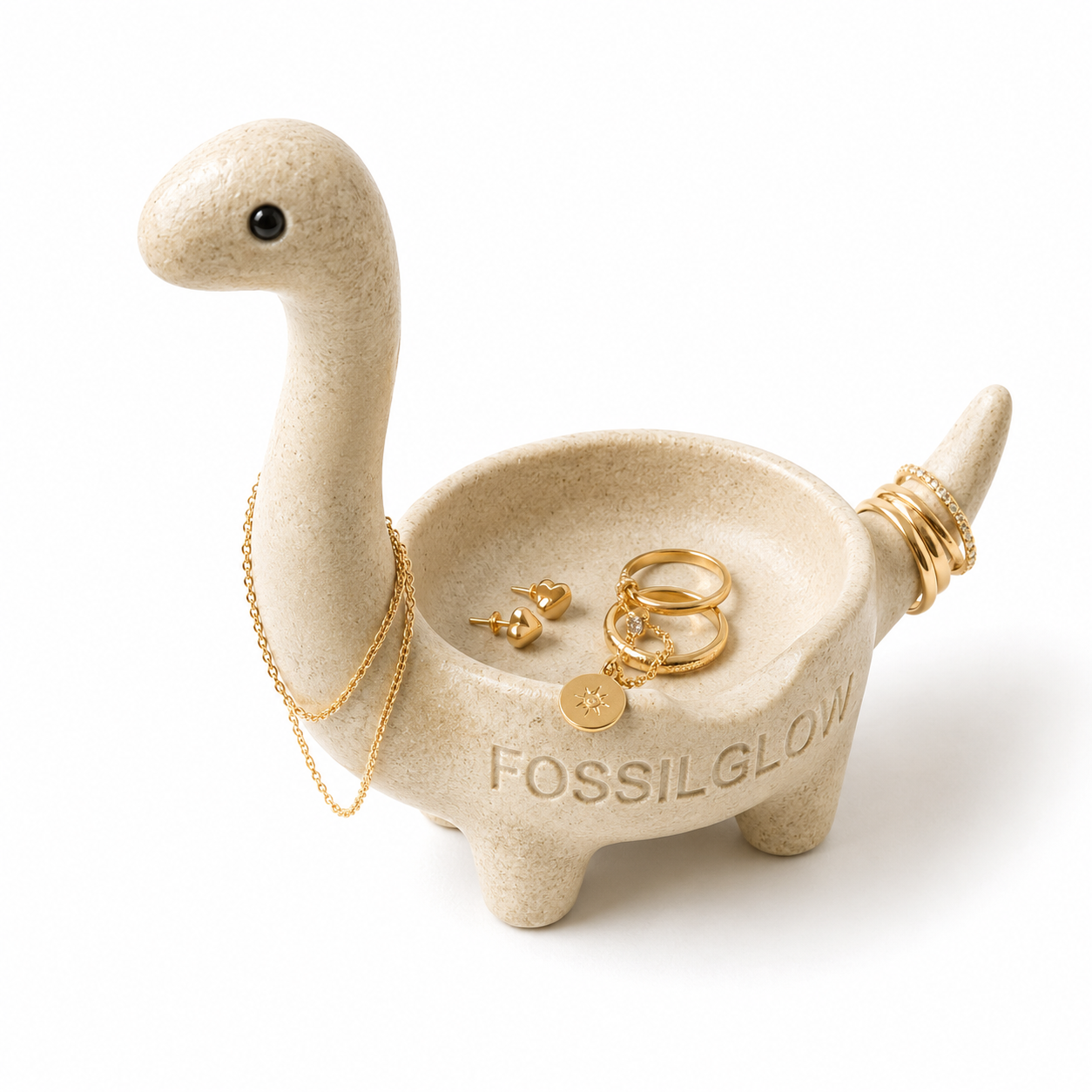 Bronto Jewelry Tray in Fossil Ivory on white background, holding gold rings and small jewelry pieces
