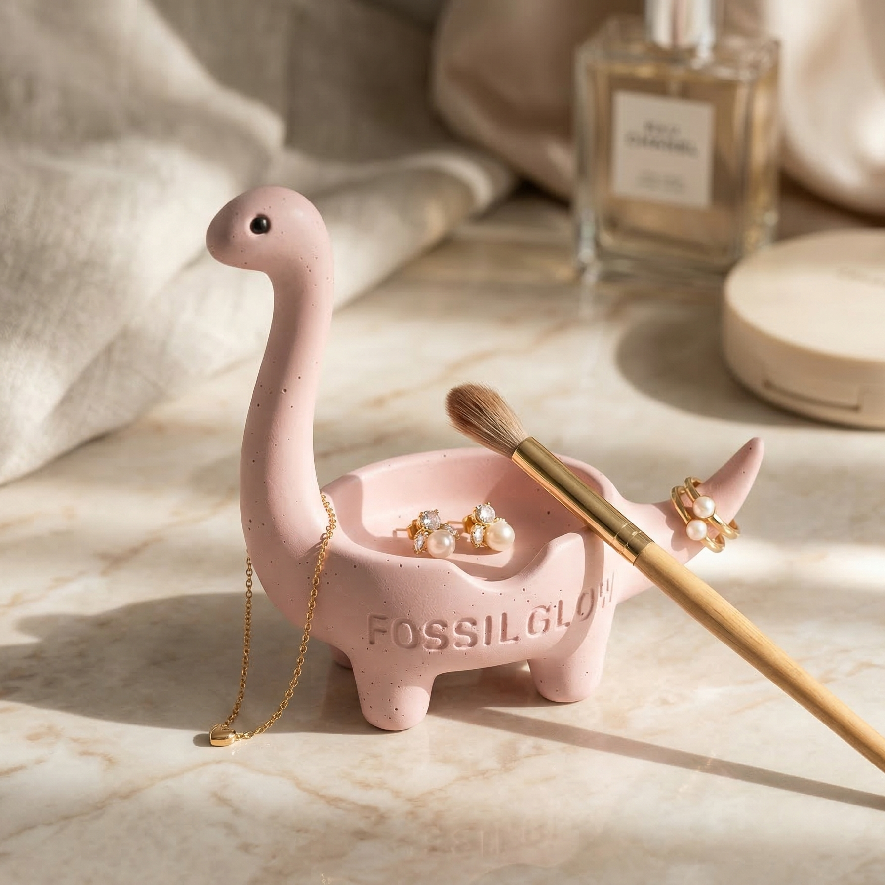 Blush Pink Bronto Jewelry Tray on a marble vanity top, hairbrush and pendant jewelry resting inside